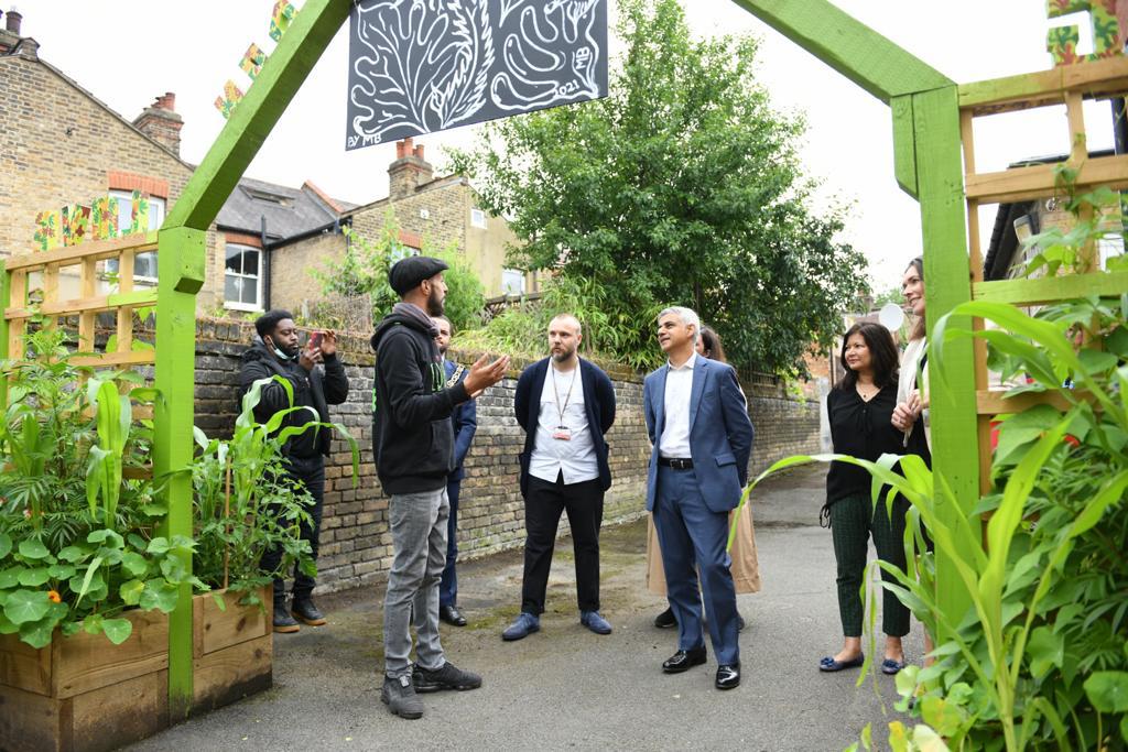 Photo of Mayor of London, Sadiq Khan getting a tour of Haringey Council's Cookbook Edible Library project. 