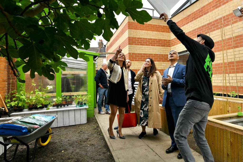Photo of Mayor of London, Sadiq Khan getting a tour of Haringey Council's Cookbook Edible Library project. 