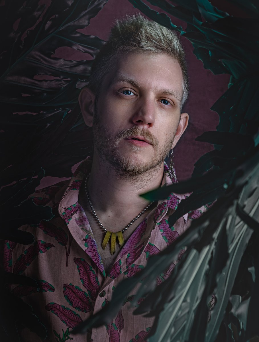 A portrait of Bobby Foxx, owner of Greyfox, a bridal photography studio.