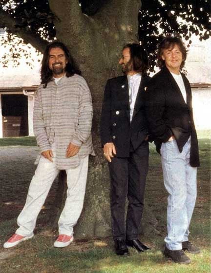 The Beatles Earth on X: "In 1996, the three remaining Beatles reunited.  They were feeling empty during the photoshoot without John Lennon being  there. A white peacock then mysteriously appeared behind George