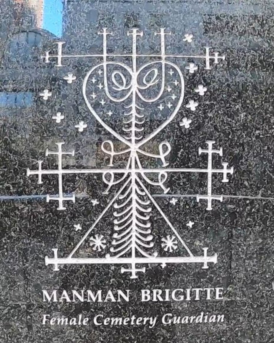Image: Color photograph of the Manman Brigitte symbol at the outdoor memorial.