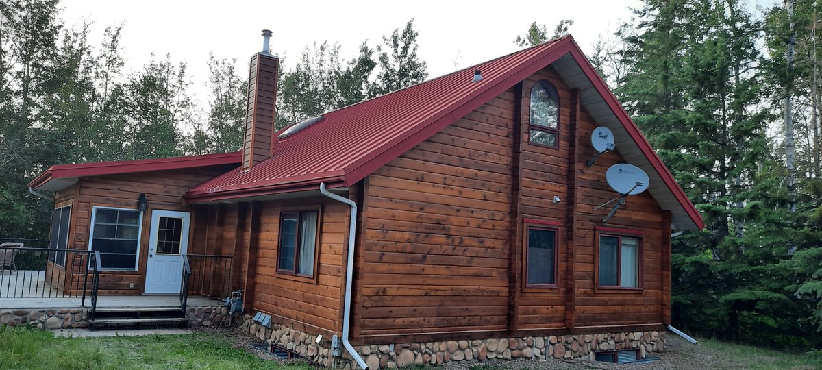 A beautiful cedar log home refinish with a small bit of restoration completed in the Garner Lake area near Smoky Lake.  Refinished in Sansin SDF Autumn Gold. #loghome #logcabin #logrestoration #logrefinish
