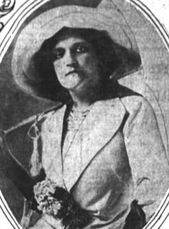 [109 years ago today] May Tully, from a 1912 newspaper. A white woman, unsmiling, wearing a tailored jacket and a widebrimmed hat; she has a corsage attached near her waist. commons.wikimedia.org/wiki/File:MayT…