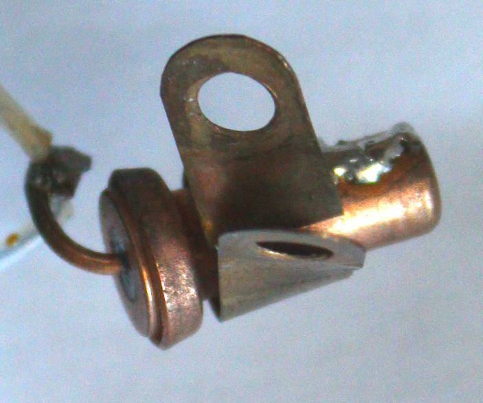 kenshirriff's tweet photo. Can anyone identify this 1960s mystery component for me? It's copper, 15mm long, bolted to ground. I'd think "diode" but it measures 10Ω either direction. It's in a low-current battery device that is powered through this. It's much chonkier than seems reasonable. Any ideas? https://t.co/Ygy5eMSSVT