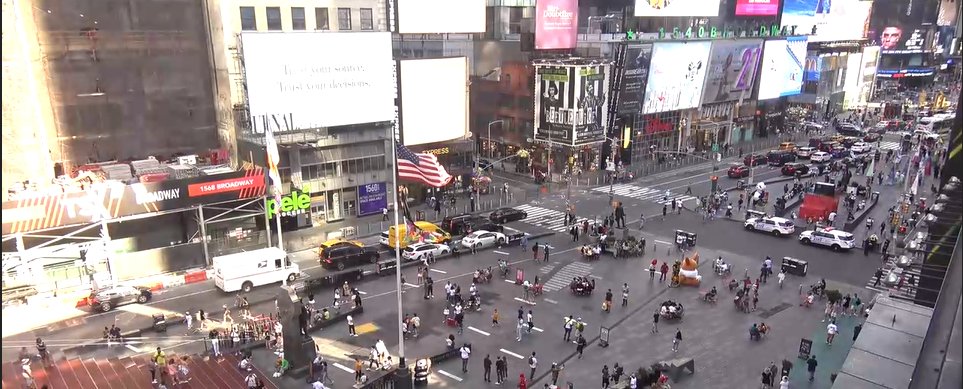 NYC's mayor just told us to turn off our air conditioners. The brands of Times Square are still blazing and consuming. These are screenshots of live webcams taken just now.