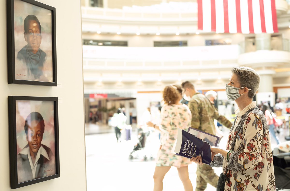 CityofAtlanta's tweet photo. The City of Atlanta unveiled a new installation @ATLAirport honoring the lives of Atlanta children gone too soon. Artist Dwayne Mitchell created over 30 portraits to memorialize the victims of the Atlanta Child Murders. https://t.co/bawWpkbKu5