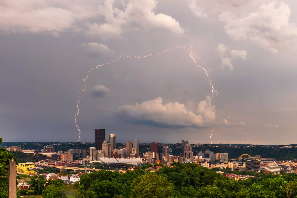 DaveDiCello's tweet photo. This afternoon I shot one of my new all-time favorite images of lightning over #Pittsburgh. Probably the tallest and longest set of strikes I've ever captured, going through a cloud and hitting on either side of the city. It was incredible to watch the storms roll through. https://t.co/q2XtvUeJjo