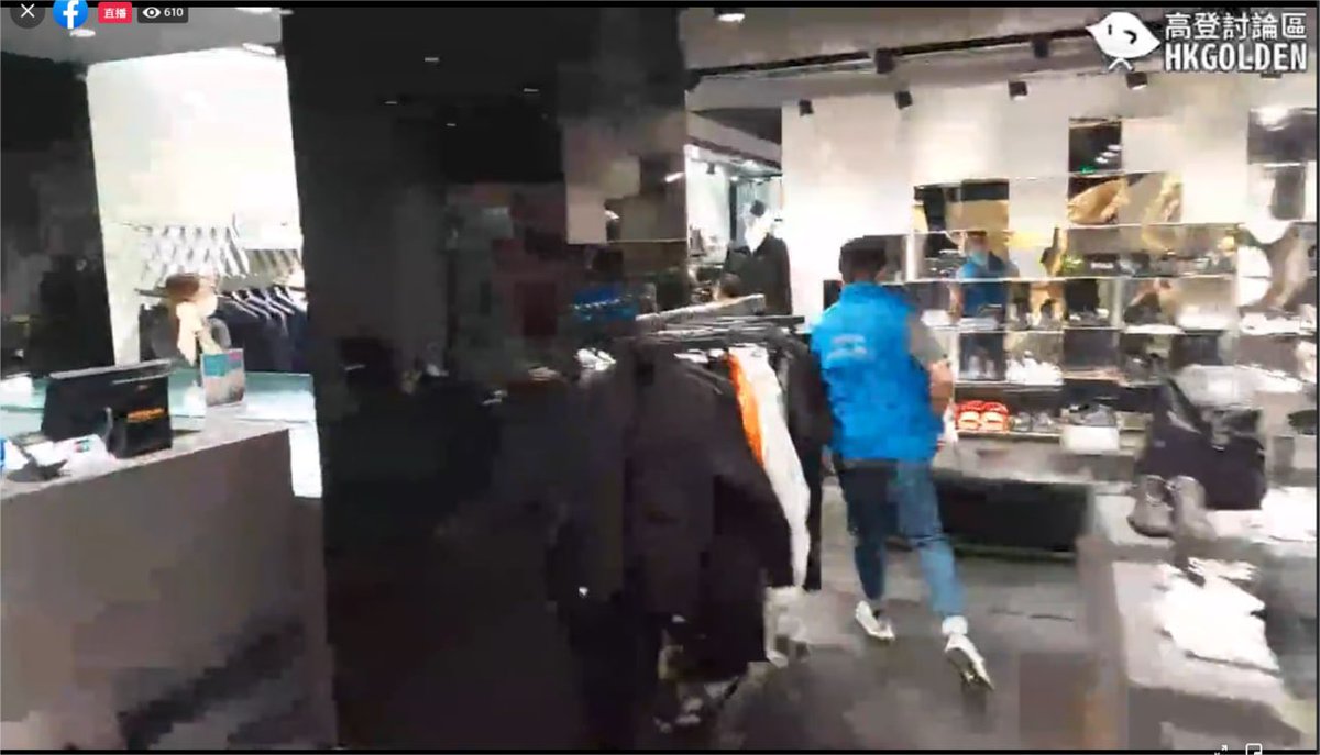 MenSuen's tweet photo. Utterly out of control #CCP and #HongKong police - storming into a shoes shop to grab a child! WTF seriously? It was just a customer who happened to be wearing black! https://t.co/YtyJTeV2ep