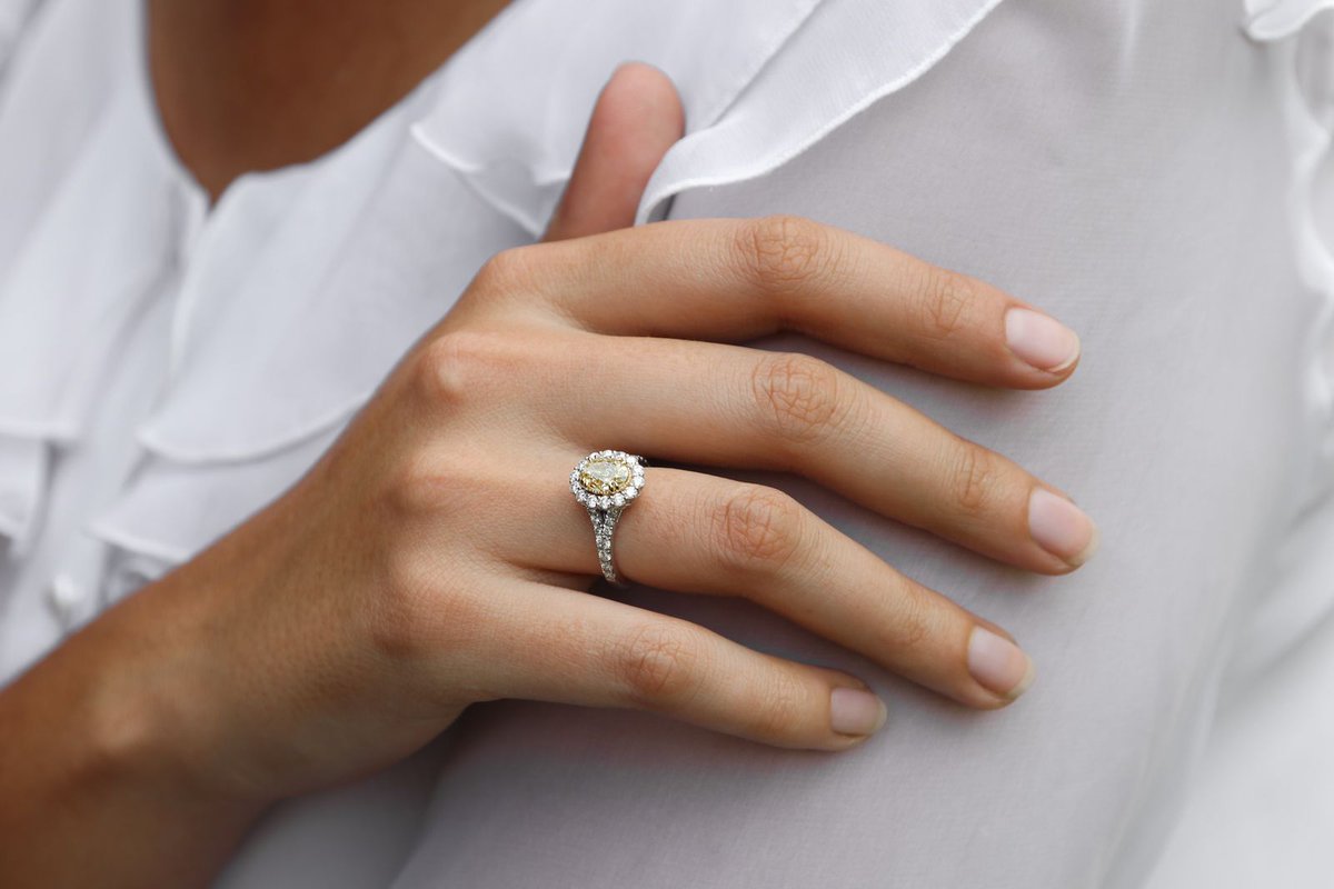 A Jenna Clifford engagement ring with a fancy yellow diamond main-stone.
 A yellow diamond ring is said to bring blessings of joy and prosperity in couple’s life.
 #jennaclifford #engagement #engagementrings