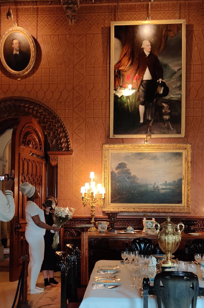 Marian Gwyn (@mariangwyn) on Twitter photo Emotional visit to @NTPenrhynCastle with April-Louise Pennant, descendant of enslaved of Lord Penrhyn. She lays white flowers as memorial to her ancestors by his portrait, the owner of 1k people. <a href="/ColonialCountr1/">Colonial Countryside</a> <a href="/corinne_fowler/">Corinne Fowler</a> <a href="/BLMCymru/">Black Lives Matter Wales</a> <a href="/rcccymru/">Race Council Cymru</a> Emotional visit to @NTPenrhynCastle with April-Louise Pennant, descendant of enslaved of Lord Penrhyn. She lays white flowers as memorial to her ancestors by his portrait, the owner of 1k people. <a href="/ColonialCountr1/">Colonial Countryside</a> <a href="/corinne_fowler/">Corinne Fowler</a> <a href="/BLMCymru/">Black Lives Matter Wales</a> <a href="/rcccymru/">Race Council Cymru</a>