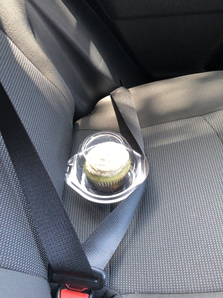 emforrester's tweet photo. I went to lunch with a @wdam coworker. He secured his pistachio cupcake for the ride back the the station 🤣 #cupcakes #pistacio #safedriver https://t.co/sOyYrJB5Vx