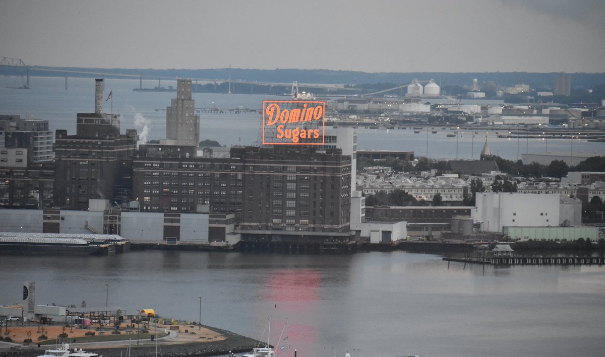 jakeonradio's tweet photo. On a gloomy looking night, the new @DominoSugar sign is shining bright! #Baltimore https://t.co/u7nWxZdPA1