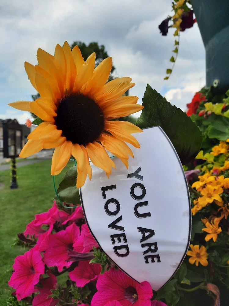 Beautiful yarn bombing by @GlosSunflowers with messages of hope #suicidesupport #youareloved  @SuppStonehouse