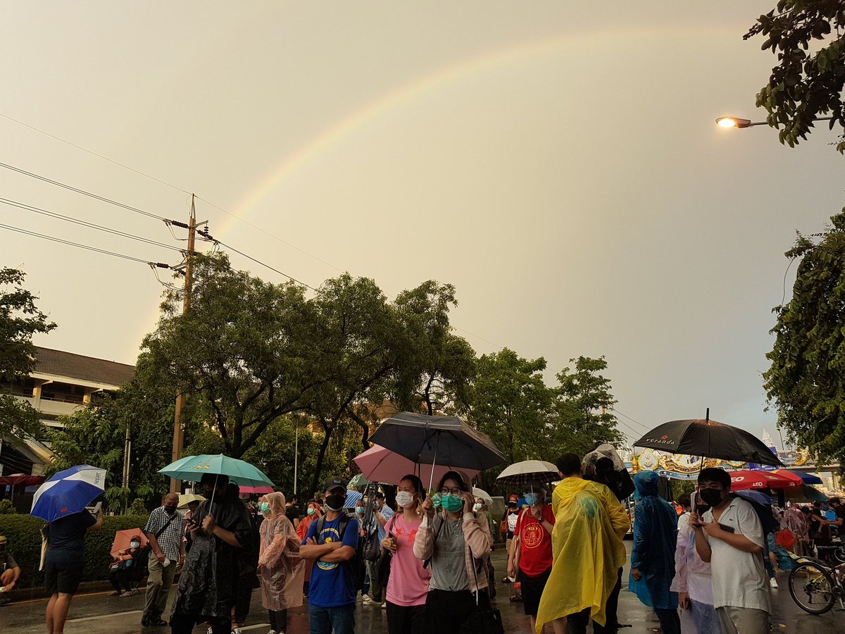 MayWongST's tweet photo. As rain slows at #Thailand #Bangkok protest outside government house, a rainbow has appeared to the delight of the demonstrators #ม็อบ2กรกฎา #whatshappeninginthailand https://t.co/ZKyrK76bwJ