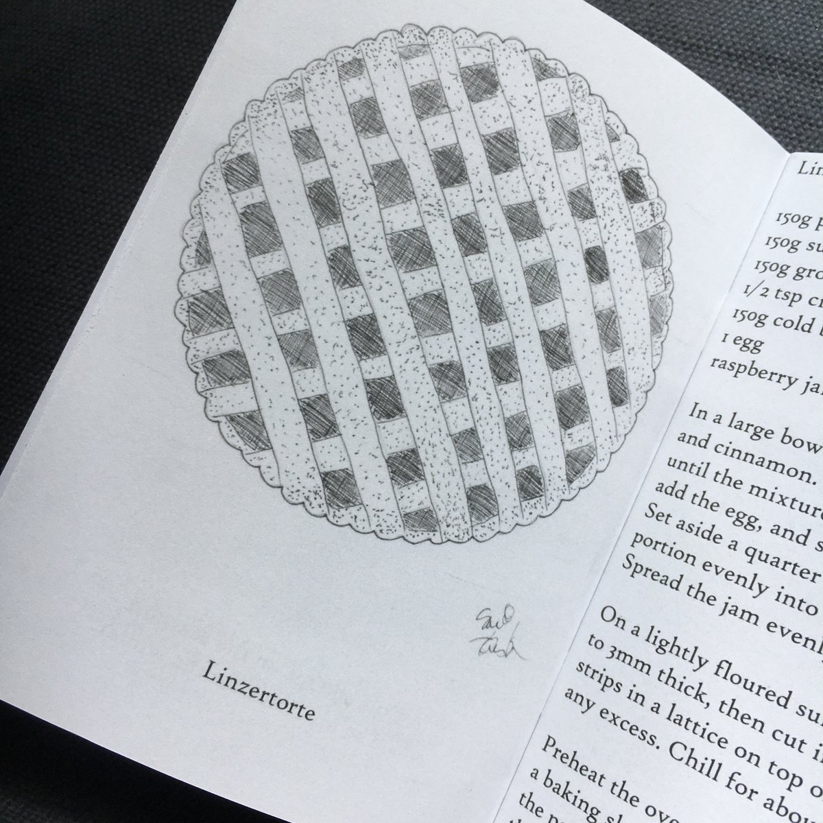 A black and white pen illustration of a linzertorte.