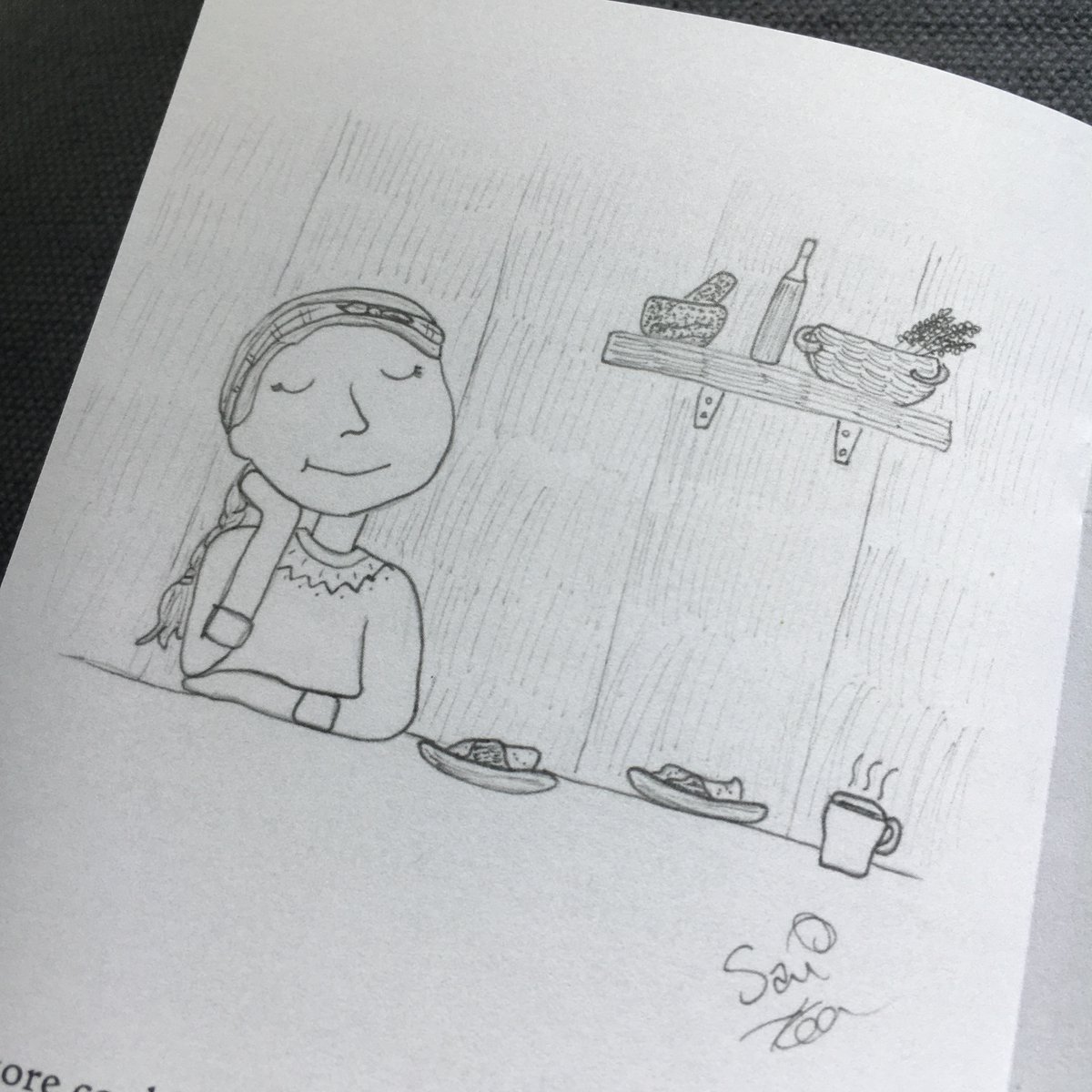 The woodsman sits at her kitchen table. She has set out two plates of cake and an extra cup of tea.