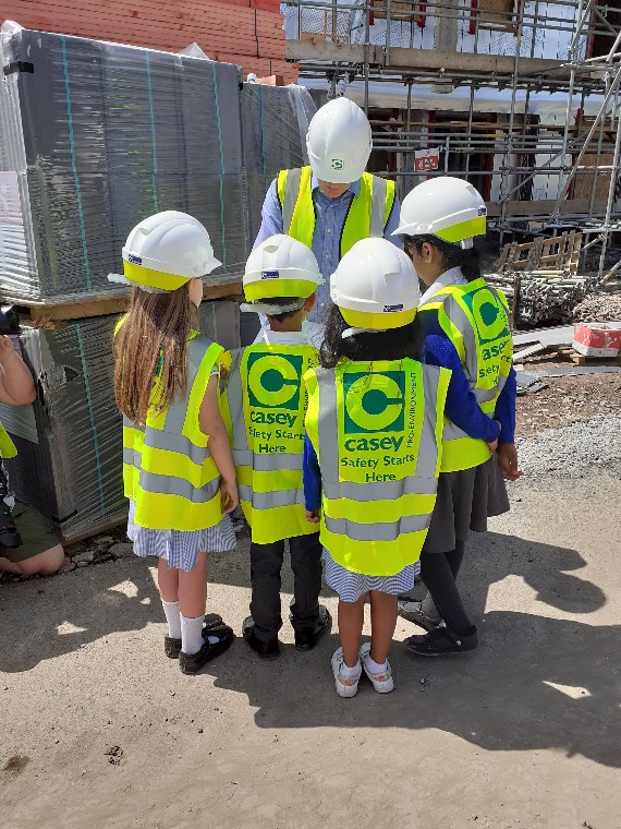 CaseyCompanies's tweet photo. Earlier this week we welcomed some lovely pupils from Our Lady &amp; St. Philomena’s Catholic Primary School to our Altbridge site for @CobaltHousing.
We provided Hi-Viz and hard hats for the children, and they will be able to keep these as a memory of their visit. 
#improvinglives https://t.co/sRjqZLs4Si