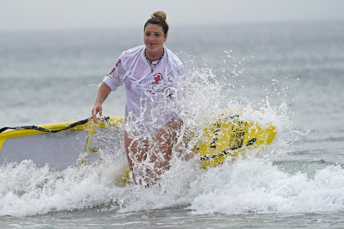 PressHerald's tweet photo. This is lifeguard Alyssa Mastrocola training at Old Orchard Beach #Maine. There's a high surf advisory for York County today until midnight. Don't make her go in the water after you. Robert Bukaty AP photo https://t.co/pdooZfUDLa