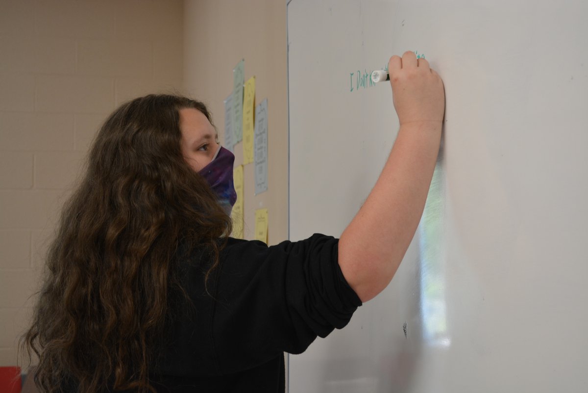 Erie1BOCES's tweet photo. Senior Ryan Burgin from @NTCitySchools writes a sentence on the whiteboard during class at the College and Career Readiness Academy at EDGE. #BOCES #ExceptionalEd https://t.co/rk66TkQ60J