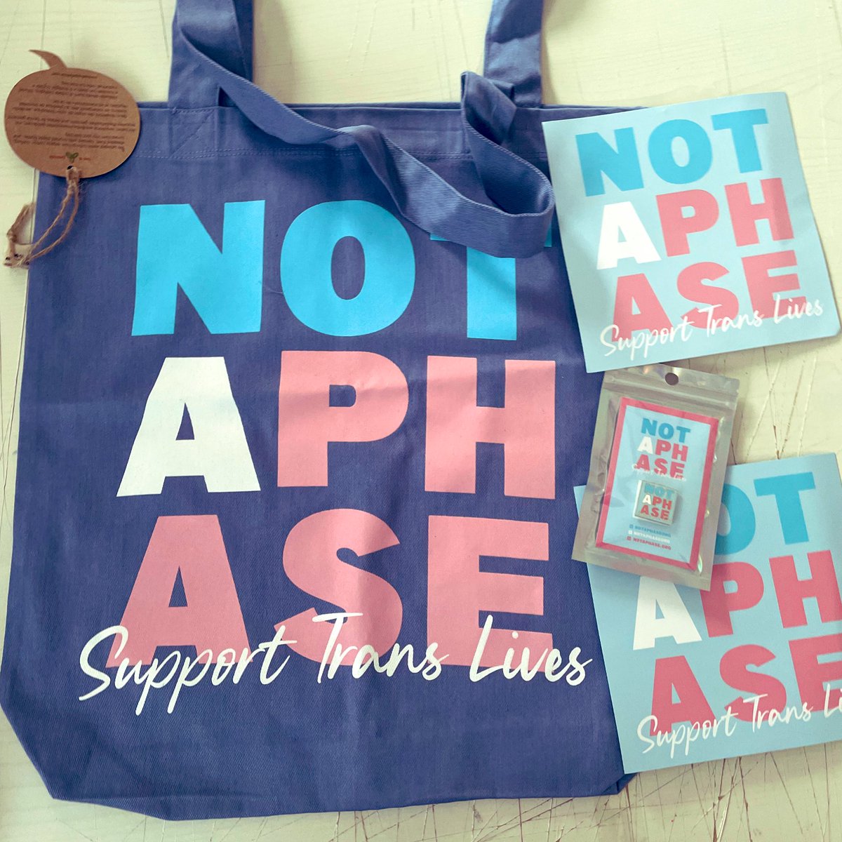 Love my <a href="/NotAPhaseOrg/">Not A Phase</a> tote bag, pin and stickers! #protecttranslives