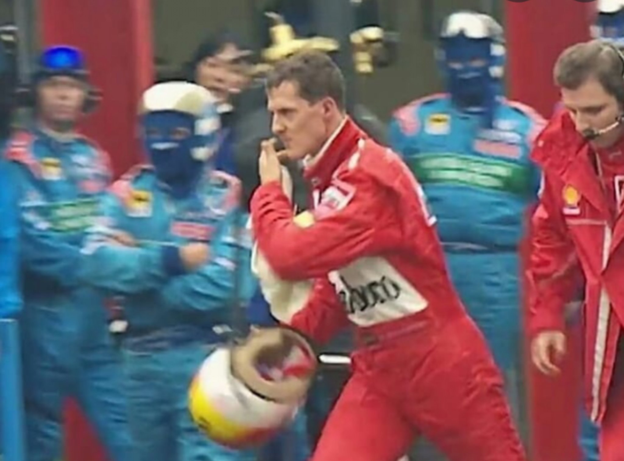 Fernando Alonso on his way to Vettel\s box to wish him happy birthday    