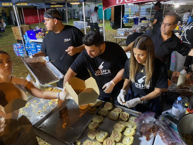 ColumbusHS_Mia's tweet photo. Josh Pascual '05 and Adrian Ferenadez-Romani '05 of Josh's Premium Meats served warm meals to first responders working day and night at the Surfside condo collapse site. The duo even reconnected with one of their first responder classmates, Jorge Cruz '05. #CPride #Adelante https://t.co/le7ZN471K2