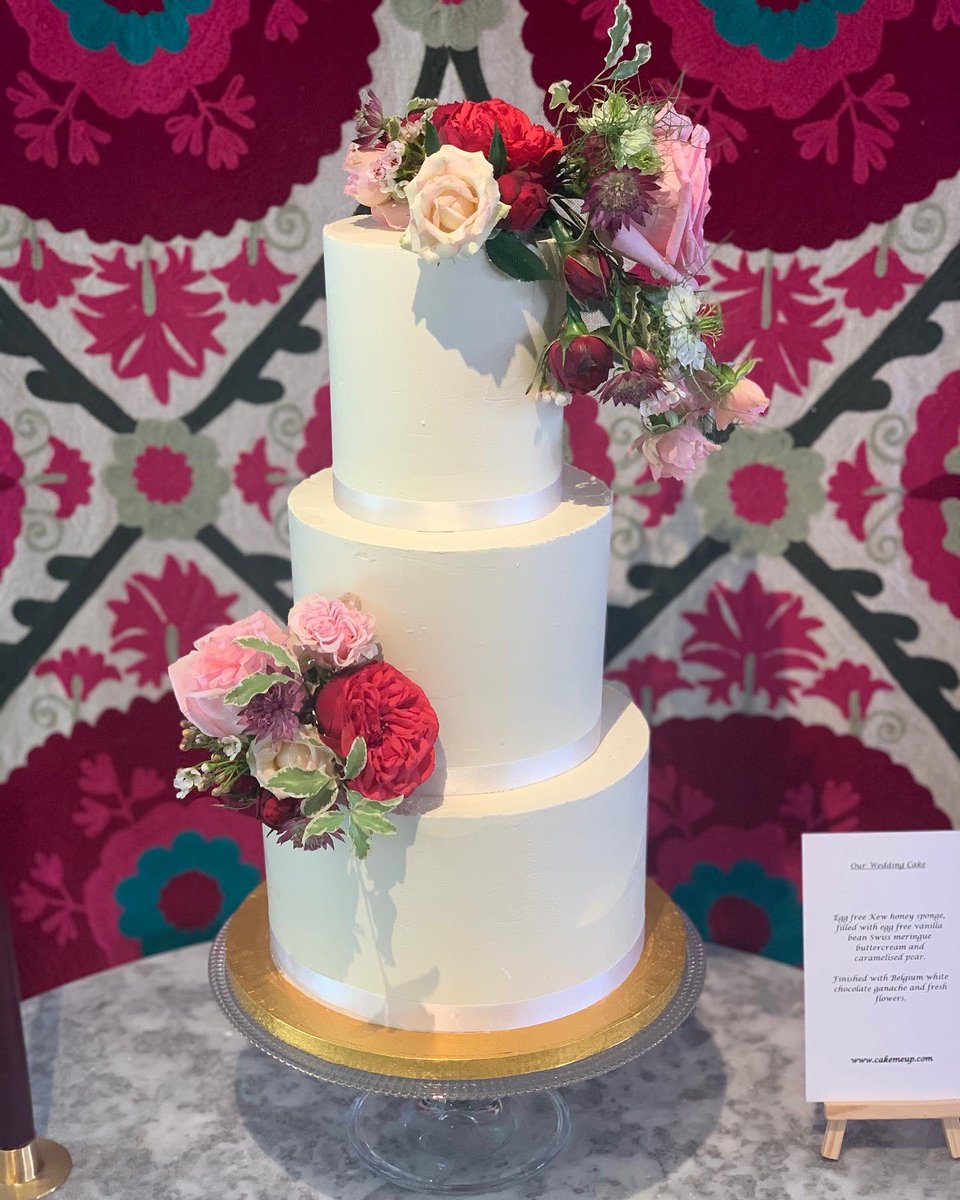 3 tiers of honey cake with white chocolate ganache and fresh blooms 💐
