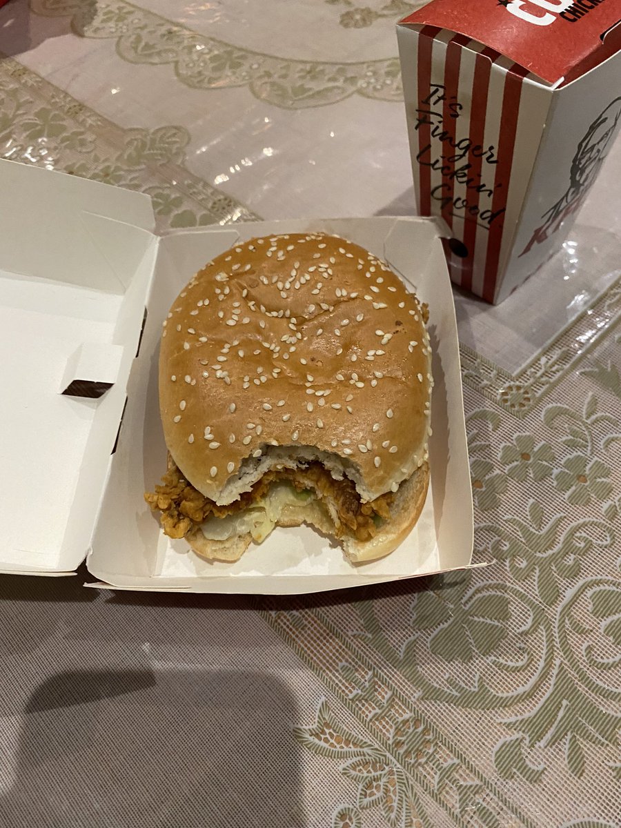 Kapppsss's tweet photo. Receiving your KFC burger from @kfc #finchleycentral #branch with a bite from the driver or staff! Fucking unacceptable. 
#disgusting #behaviour https://t.co/FN7TnjuD4E
