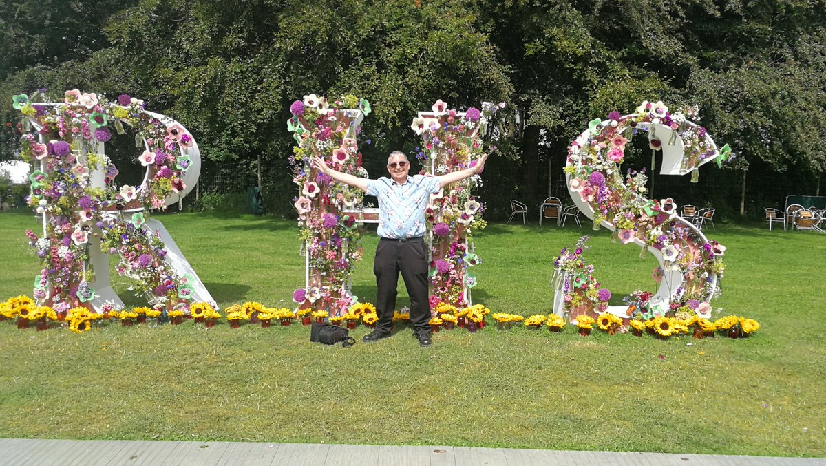 TimHowellX's tweet photo. #CountdownToTatton #RHSTatton 10 days to go. Florist @jpmoseley produces the most spectacular displays at @the_rhs shows. Here he is starting work on the “RHS” letters and here's the completed display with the very beautiful @misJORGIEPORTER plus in the last image it's me😀 https://t.co/aDr7t4rt3K
