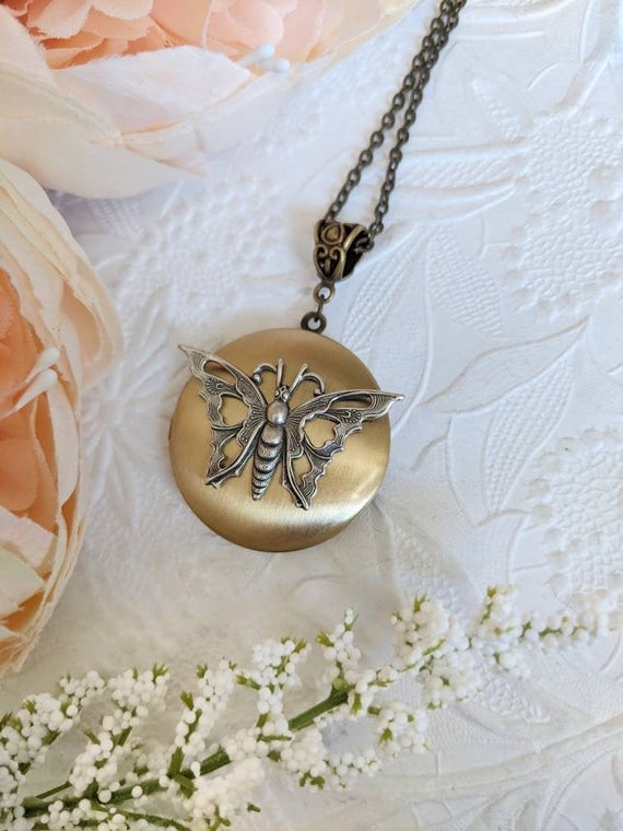 Butterfly locket necklace, antiqued gold locket, etsy.me/3w6K9TF #jewelry #necklaces #lockets #butterflylocket #butterflynecklace @etsymktgtool