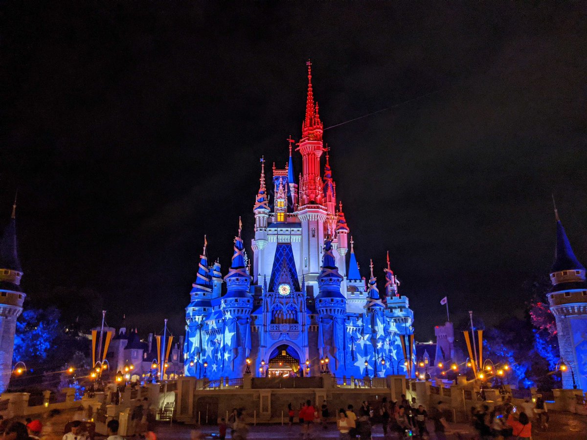 Cinderella Castle is illuminated in red, white, and blue tonight