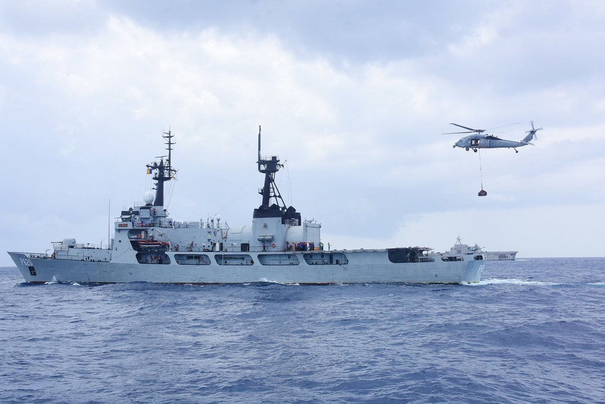 USSriLanka's tweet photo. Photo
A MH-60S Sea Hawk helicopter attached to US Helicopter Sea Combat Squadron (HSC) 21, assigned to littoral combat ship USS Charleston (LCS-18), flies with cargo during a vertical replenishment exercise with Sri Lanka Navy Advanced Offshore Patrol Vessel SLNS Gajabahu (P-626) https://t.co/2BcAXkXm68