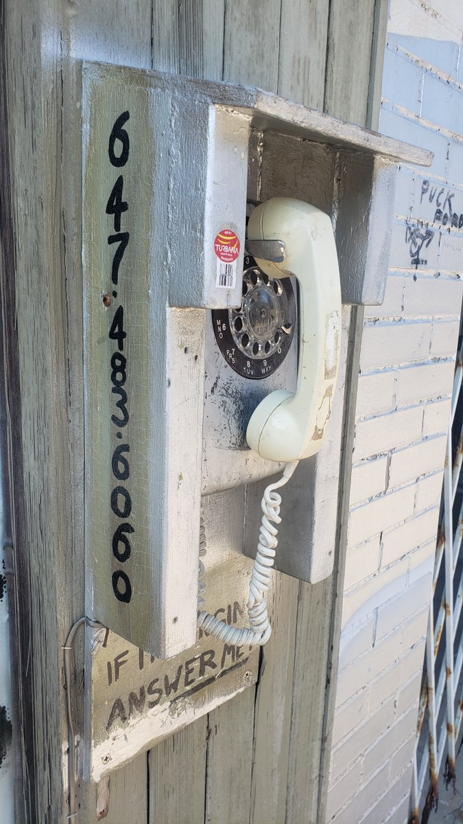 The phone is fixed, at least until the next drunk asshole destroys it.

Call 647-483-6060 to talk to a random person on Bloor Street.