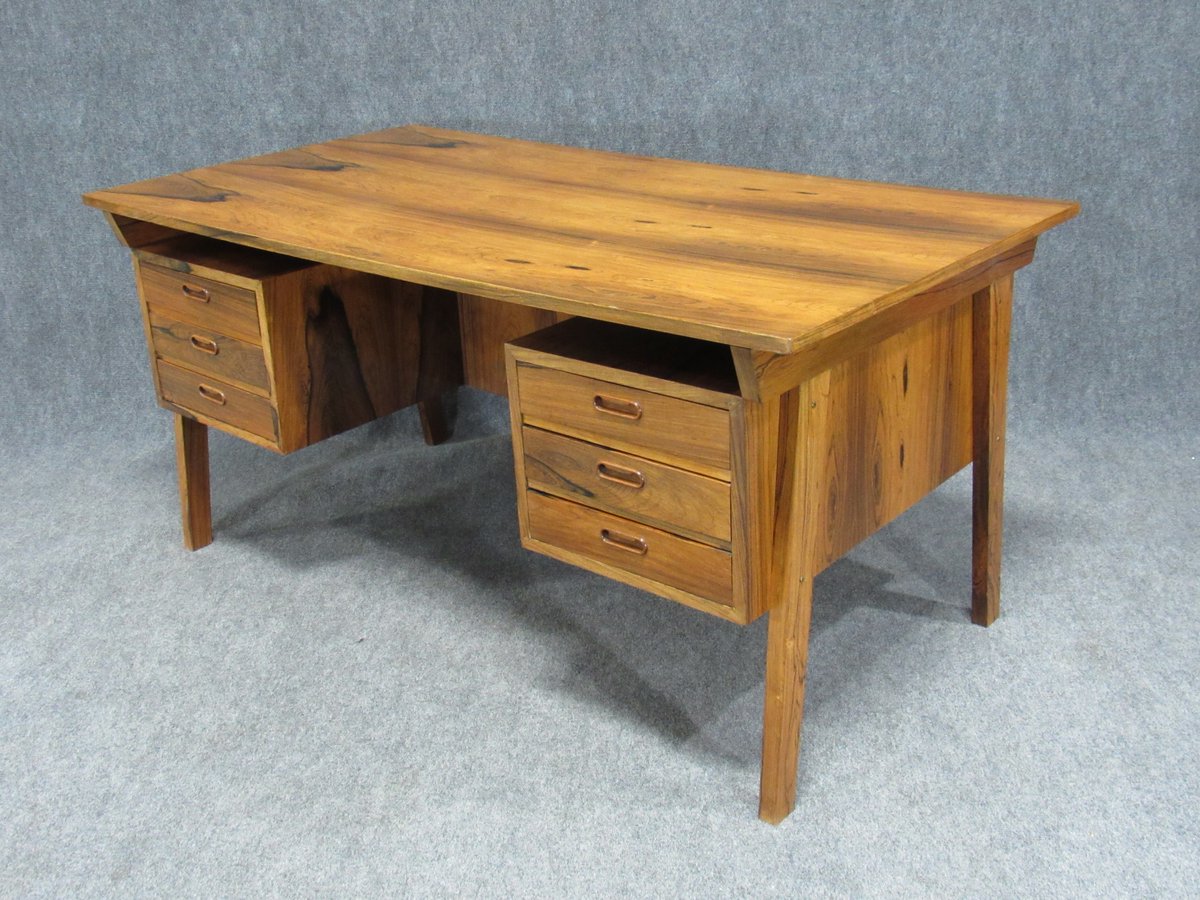 Midcentury Danish modern desk crafted in strikingly beautiful figured rosewood. Exquisitely crafted piece that will be the center piece of any home office, den or workplace. Piece in excellent vintage condition. #Danishmidcentury #rosewooddesk #midcenturymodern