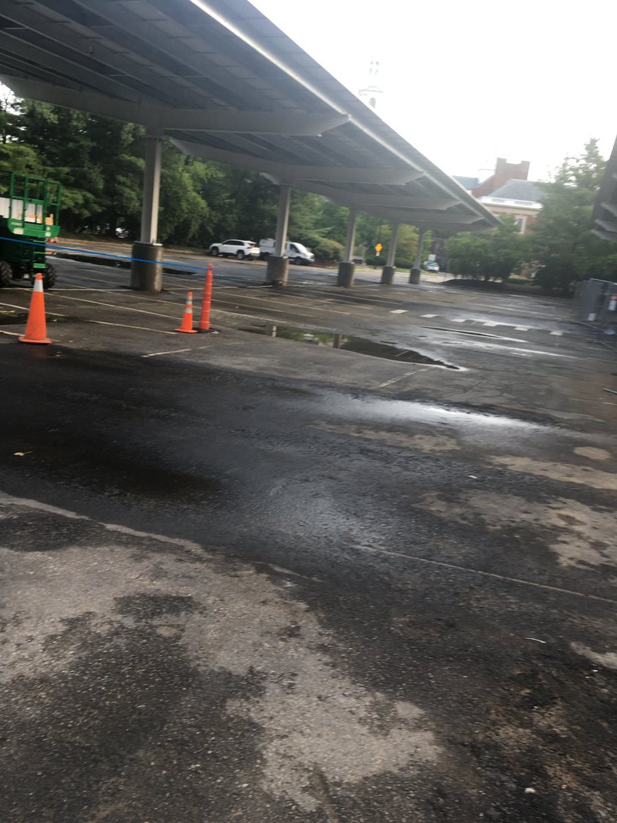 barrybergman's tweet photo. I stopped by library parking lot. City fixed a drainage issue &amp; added 21 parking places and solar carports.  They cut down 12 mature trees &amp; eliminated the grass berms that would support more trees. Removal of the trees causes this area to absorb more heat. Was tradeoff worth it? https://t.co/GjBrKQhVGL