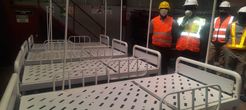 MinofHealthUG's tweet photo. Over 5,000 patient beds will be deployed to Regional Referral Hospitals to support the ongoing COVID-19 response. Earlier today, the Commissioner in charge of Health Infrastructure, Eng. George Otim inspected the ongoing works at Fabrication Systems and Atami Agencies Ltd. https://t.co/FiAtYm2mXe
