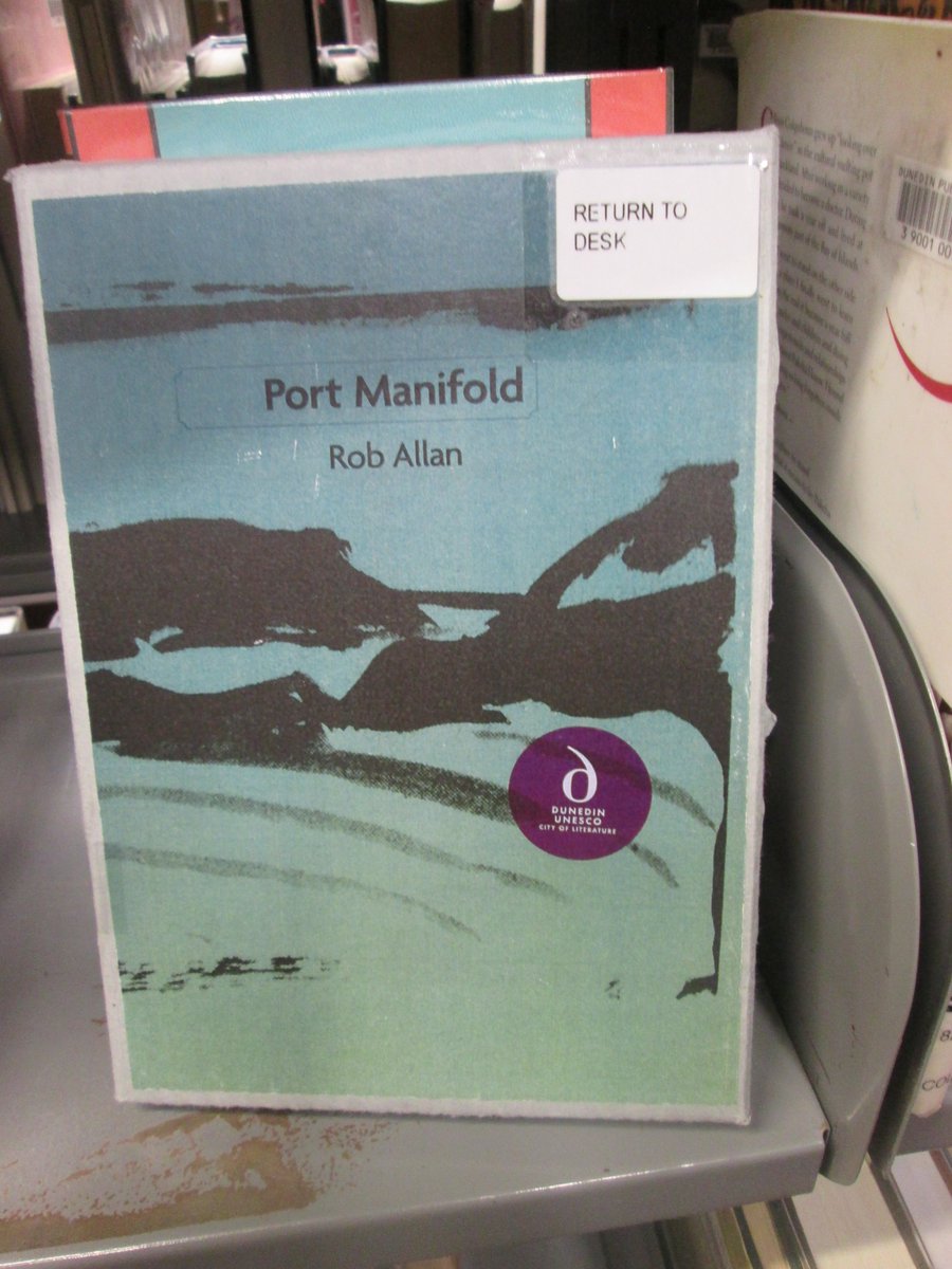 allanrob9's tweet photo. Oh look what I found in the #DunedinPublicLibrary My book of poems "#PortManifold".The nice #Library made a box for the three chapbooks. Very kind. Thankyou. My first volume of poetry was stolen, " #KaritanePostcards" & as it is now a collector's item the DPL aint getting another https://t.co/4fLpI0UNUH