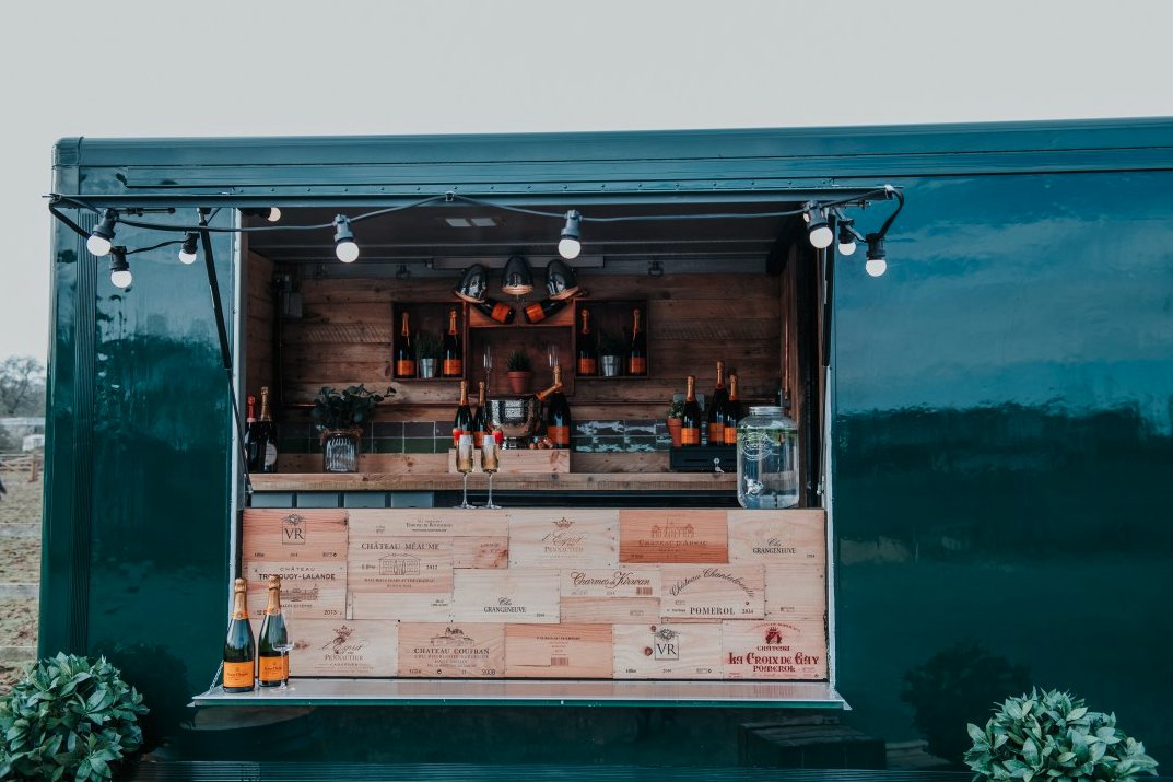 Holloway Events' beautiful hand-crafted mobile bar was created in 2019, characterised by its British Racing Green &amp; outstanding rustic wooden interior. With over 20 years of industry expertise, you can be sure their service and drinks are top-notch!