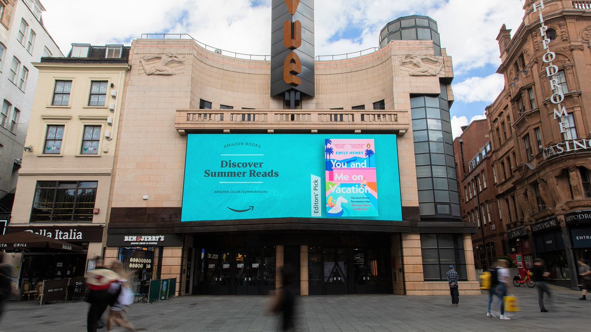 PenguinUKBooks's tweet photo. Things we love to see: #YouAndMeOnVacation on a giant billboard in Leicester Square!
We’re thrilled Emily Henry's feel-good rom-com has been included in @AmazonUK's celebration of summer reading 📚☀️
Check out their full #SummerReadingGuide here: https://t.co/eVHT4Q99uu https://t.co/b7hVigFbOo