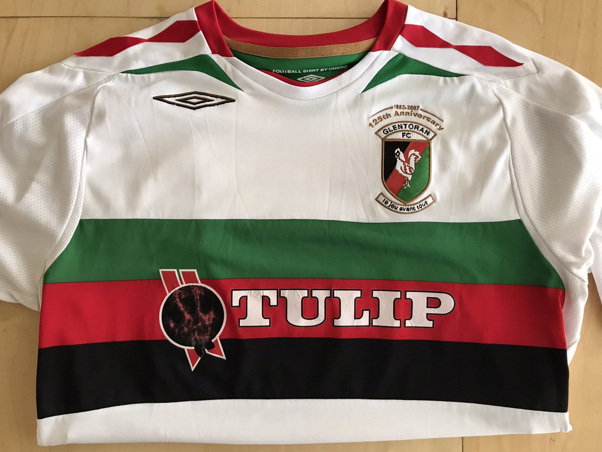 ProfRSGrayson's tweet photo. Another great shirt in my collection from Alan McDonald’s time as Glentoran manager. Sadly, the Tulip logo came off in the wash a few months ago as the second photo shows. But thanks to brilliant work from Harriet at @TeamWare_Merch in Hemel the logo has been recreated as new. https://t.co/Pa4uXUN3Rz