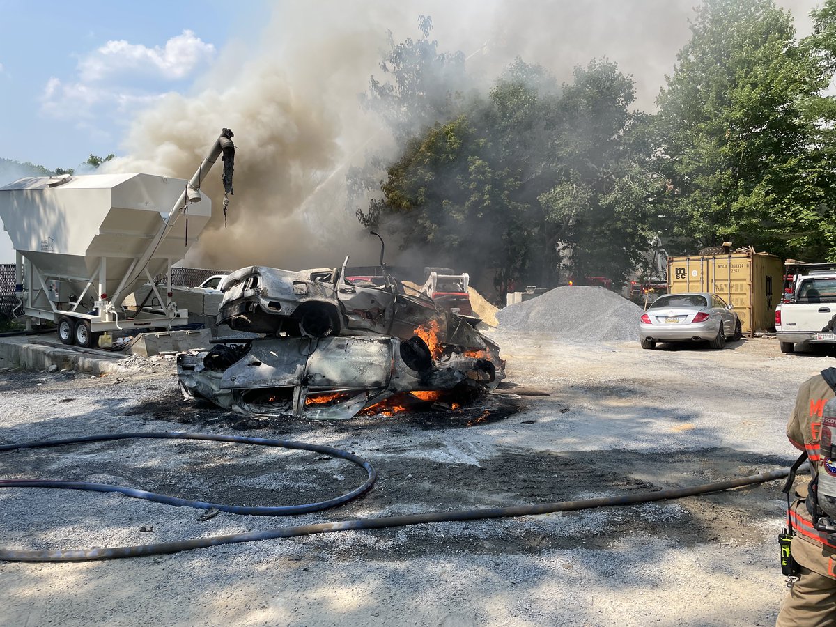 mcfrsPIO's tweet photo. (~330p Initial Dispatch) 15100blk Southlawn Ln., Rockville, Commercial Building with a large amount of debris, junked cars and tires on fire (part of the building involved) protracted incident, Area roads CLOSED, ~75 FFs on scene (on scene ‘real-feel’ temperature >100°) https://t.co/wmdfyt74hf