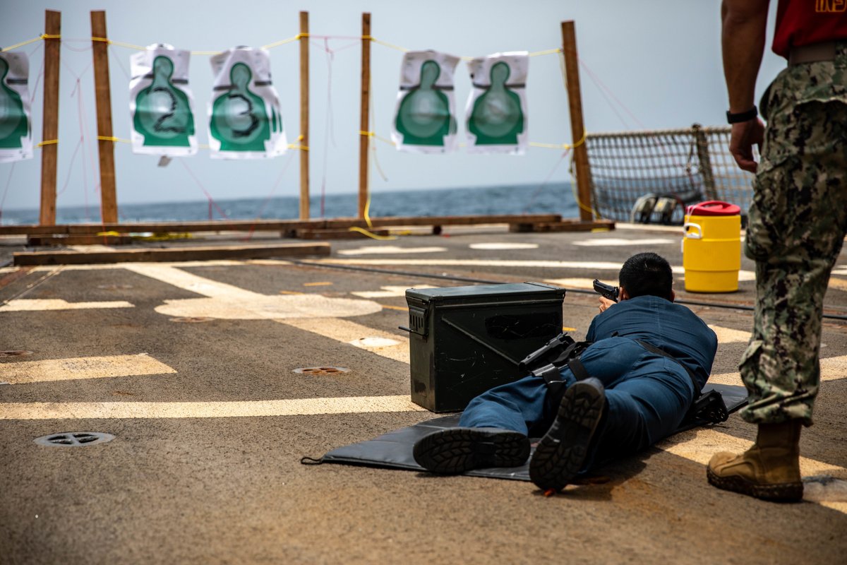 USNavy's tweet photo. Train like you mean it! 🎯 

#Sailors conduct 9mm small arms live-fire training aboard guided-missile destroyer @USSHALSEY (DDG97). #Halsey is attached to Commander, Task Force 50, deployed to the #US5thFleet area of operations.

📸: MC3 Jaimar Carson Bondurant https://t.co/aYcHU3M26v