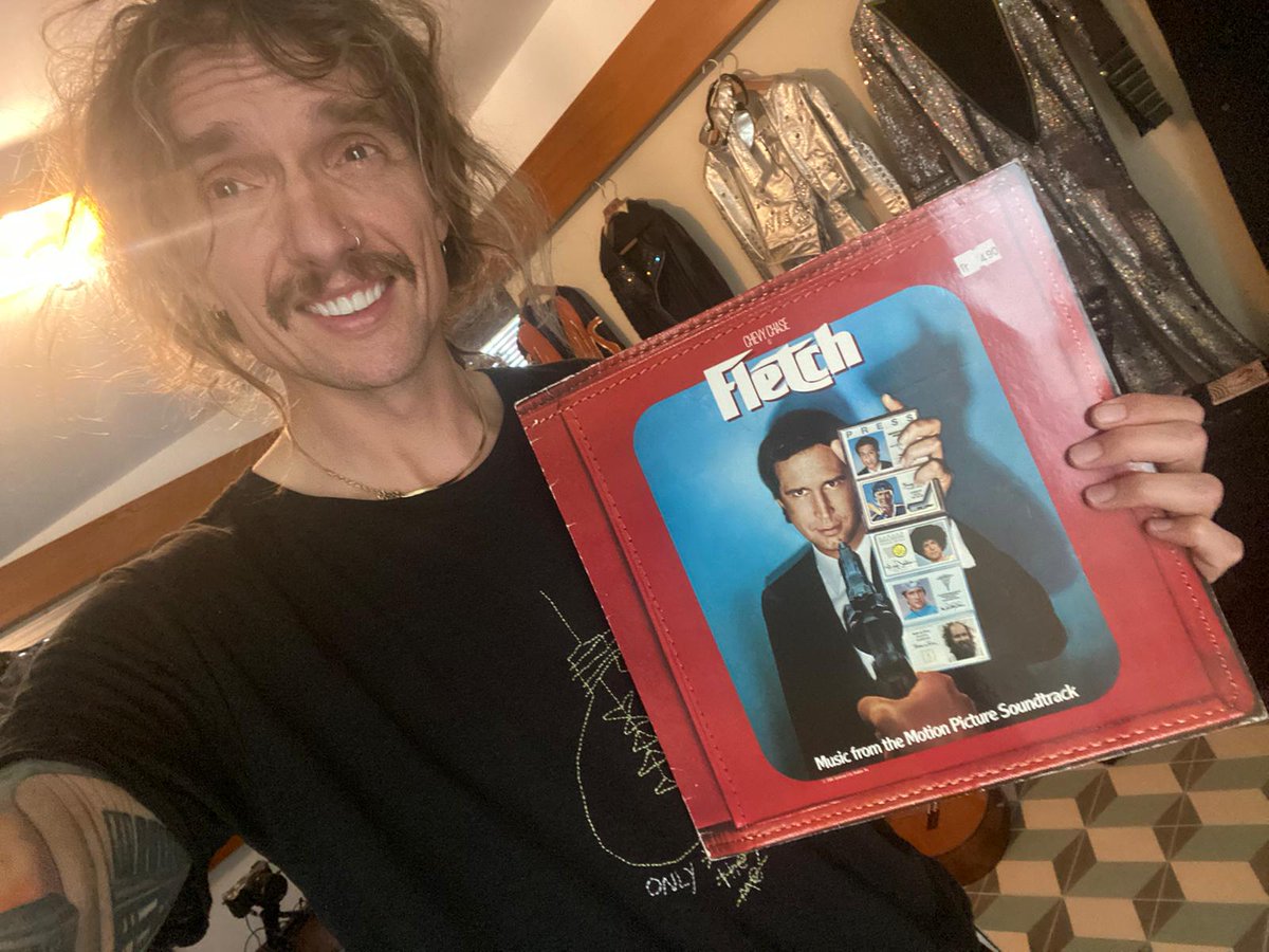 Permission to Land by <a href="/thedarkness/">The Darkness</a> was released 18 years ago TODAY. My copy is concealed within the sleeve of the Fletch soundtrack because I’m so modest.