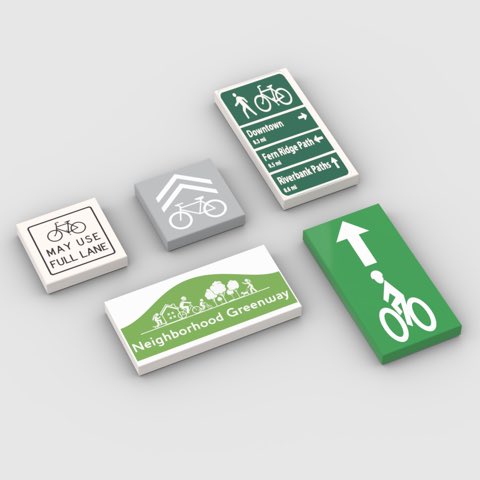 Shanerh's tweet photo. Had some of these ⁦#Lego pieces printed for my bike-friendly cityscape. May have extra. Anyone want some? Other ideas/requests for next printing? #sharrow #wayfinding #bikelane #mayusefulllane #NeighborhoodGreenway https://t.co/D0EXGhSWJS
