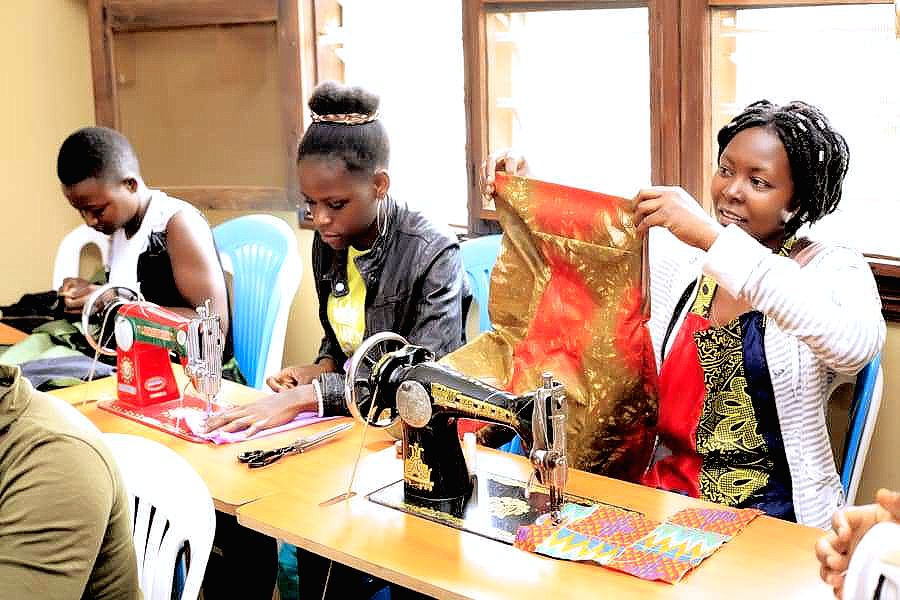 HALOFoundation's tweet photo. Sewing allows the girls in Uganda to tap into their creativity.  At HALO, we believe that art heals. Help us purchase five new computers and four sewing machines to equip our youth with the materials they need to learn new life skills. https://t.co/pqt4jUSX5K #Uganda #Art #Sewing https://t.co/HSZJv89Eu1