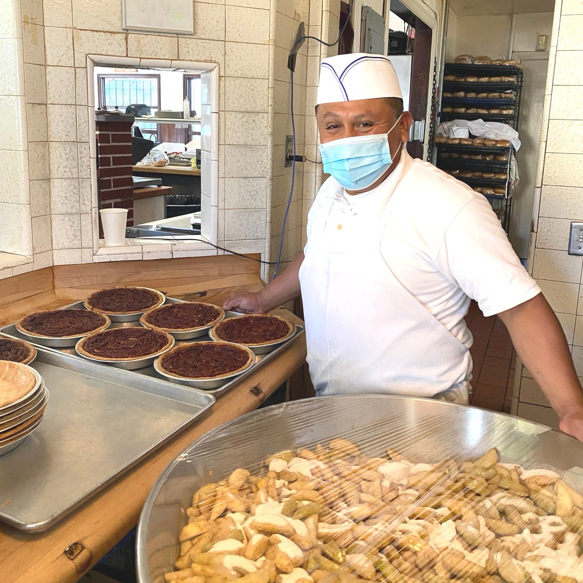 There's nothing like the smell of fresh pecan pie straight out of the oven. Rodrigo has been baking our pies for 23 years now, and the smile on his face hasn't changed! #applepan #qualityforever #pie #pecanpie #applepie #iconic #LA #baking