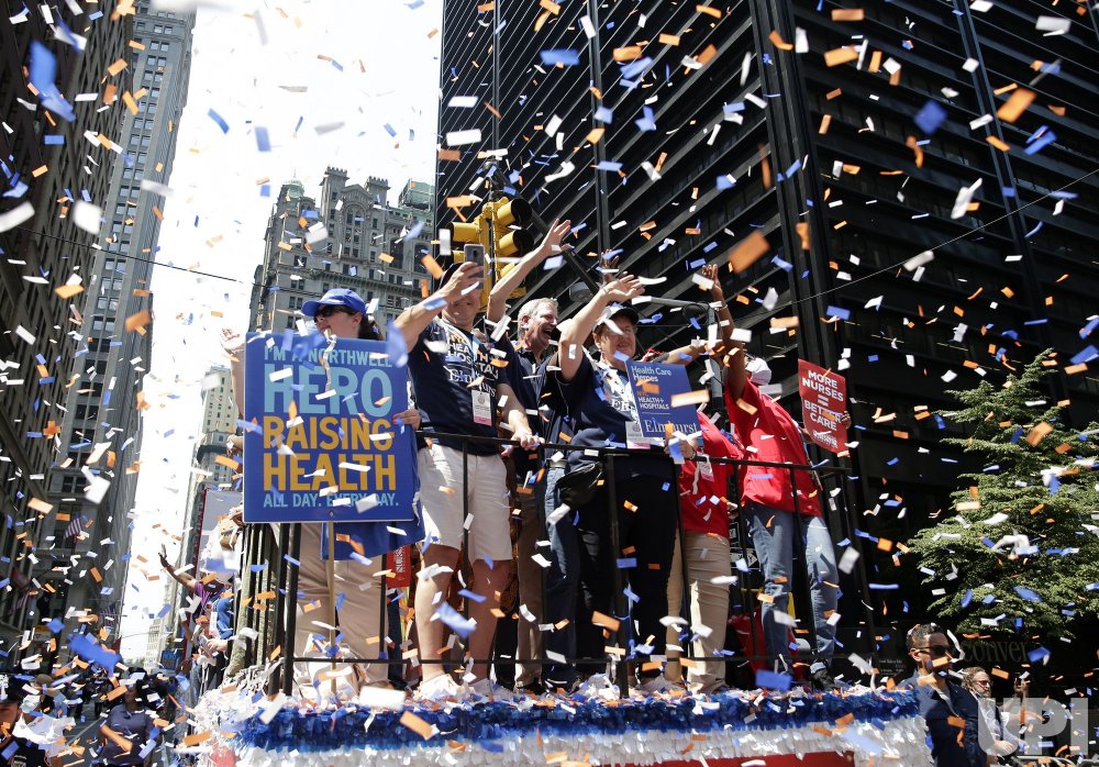 Mayor Bill Bill de Blasio moves up the parade route on a float at the 'Hometown Heroes' ticker tape parade celebrating 'the Summer of New York City' and thanking essential workers who helped New Yorkers through the worst of the coronavirus (COVID-19) pandemic in the Canyon of Heroes in New York City on Wednesday, July 7, 2021.
