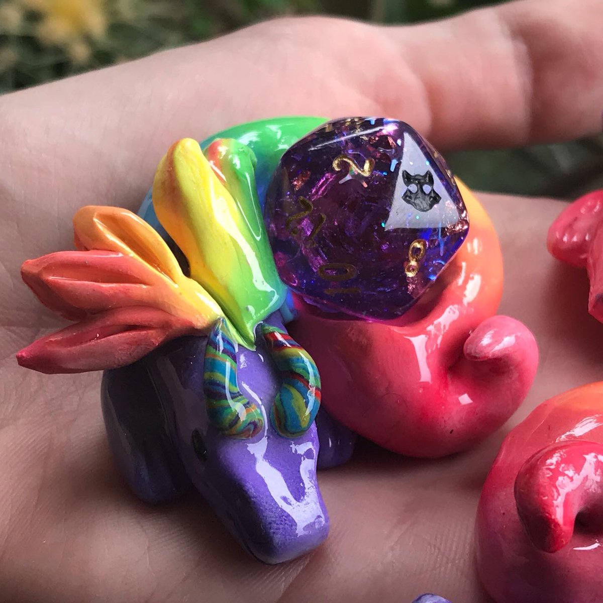 DeathwishDice's tweet photo. New sleepy d20 rainbow dragons that went up in today’s shop update! 🌈✨ these were so fun to make, and I love how they turned out 🤩 🐉 

✨More dice, dragons, and accessories available now at https://t.co/DOobOMzyuM ✨

(Shop updates every Wednesday @ 3pm EST!) https://t.co/k0ei7R9GAa