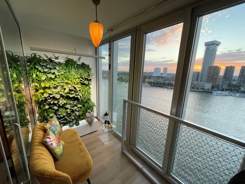 Enjoying the city skyline from a little indoor oasis! Our movable green wall adds a calming touch and has an air-purifying effect, creating a great indoor climate to relax in or get new creative ideas! Read more about the LifeMCC plant wall: sempergreenwall.com/products/lifem… #livingwalls