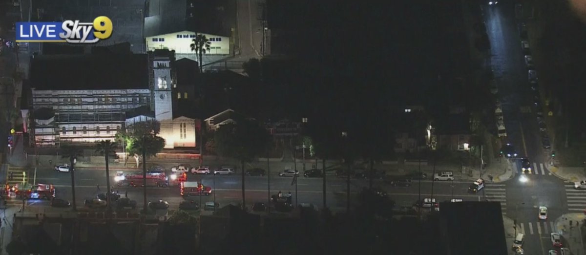 CBSLosAngeles's tweet photo. UPDATE: A man that scaled a Boyle Heights church, lit at least one fire and evaded police by dangerously jumping from rooftop to rooftop has been taken into custody. It is unclear if the man is injured from repeatedly jumping from and scaling buildings. https://t.co/VvIT5dhvJ9 https://t.co/rqqL2paK8y